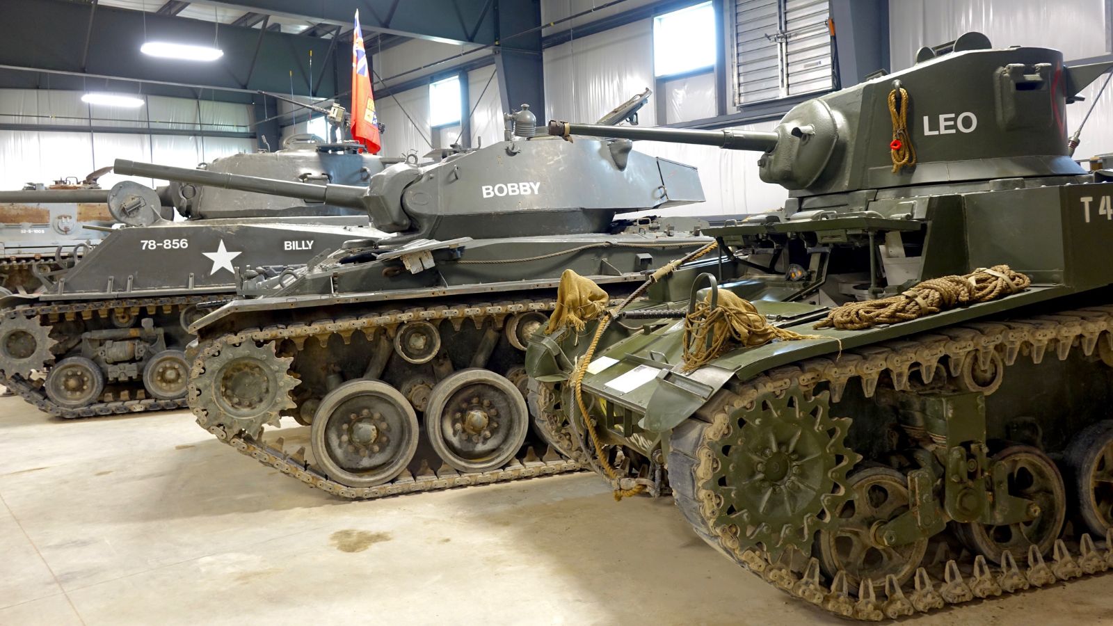Three military tanks inside the Canadian Tank Museum in Oshawa, Ontario