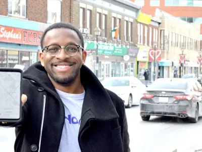 II-Hop-In-Technologies-Co-Founder_Boyd-Reid-with-App.jpg