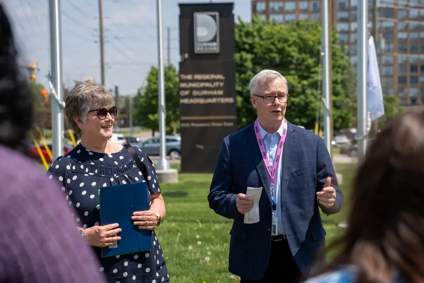 Regional Chair, John Henry, presenting the proclamation certificate for Community Living Month.