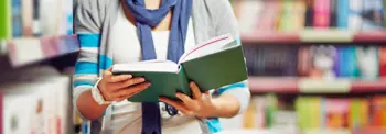 Person holding a library book open
