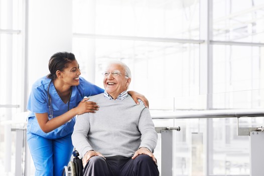 Care worker assisting a senior in a wheelchair