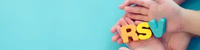 Hands holding blocks spelling RSV