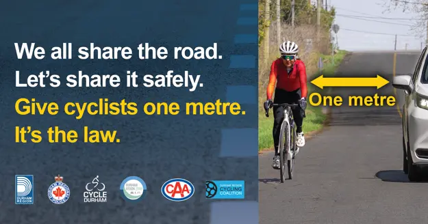 We all share the road. Let's share it safely. Give cyclists one metre. It's the law. Various local road safety partner logos. A person cycling