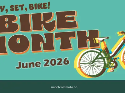 Teal promotional graphic with bold text reading “Ready, Set, Bike! Bike Month June 2026.” A colorful illustrated bicycle appears on the right, with Durham Region and Smart Commute logos displayed.