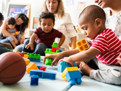 Diverse-group-of-parents-and-children-playing-together-with-blocksV2.jpg